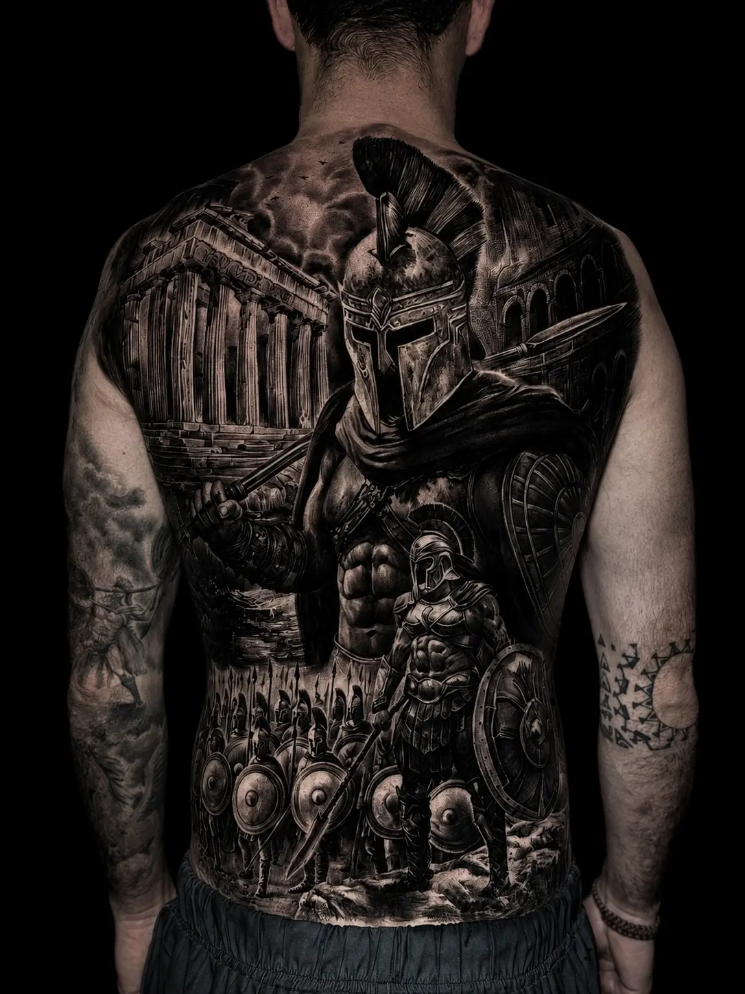 Black and grey realism sleeve with angel, skull, snake, and Greek god with lightning at Bloodline Tattoo Phuket