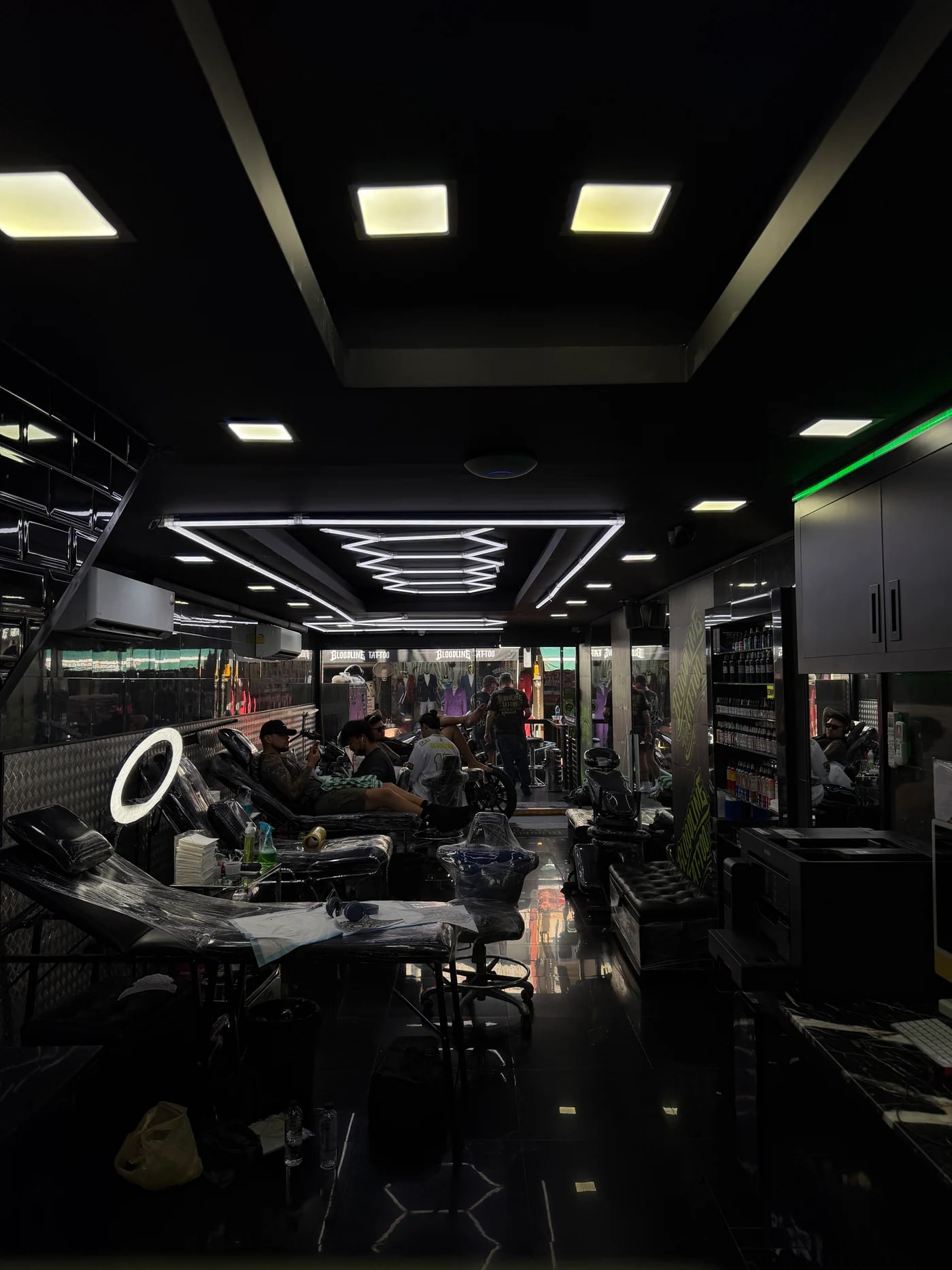 Tattoo artist working on detailed design in Phuket studio